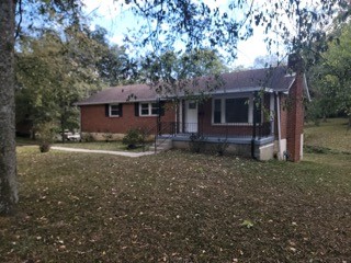 a house view with a backyard space