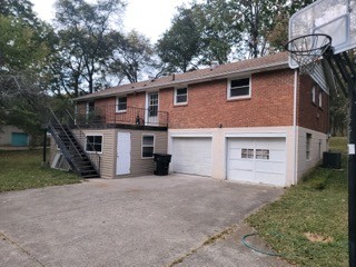 708 Vantrease Road Madison, TN 37115 - Photo 2 of 15 a front view of a house with a yard and garage