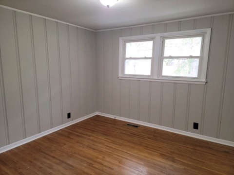 708 Vantrease Road Madison, TN 37115 - Photo 4 of 15 a view of an empty room with wooden floor and a window