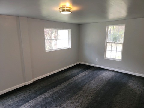 708 Vantrease Road Madison, TN 37115 - Photo 9 of 15 a view of an empty room with wooden floor and a window