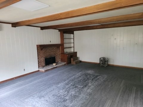 708 Vantrease Road Madison, TN 37115 - Photo 10 of 15 a view of empty room with wooden floor and fireplace