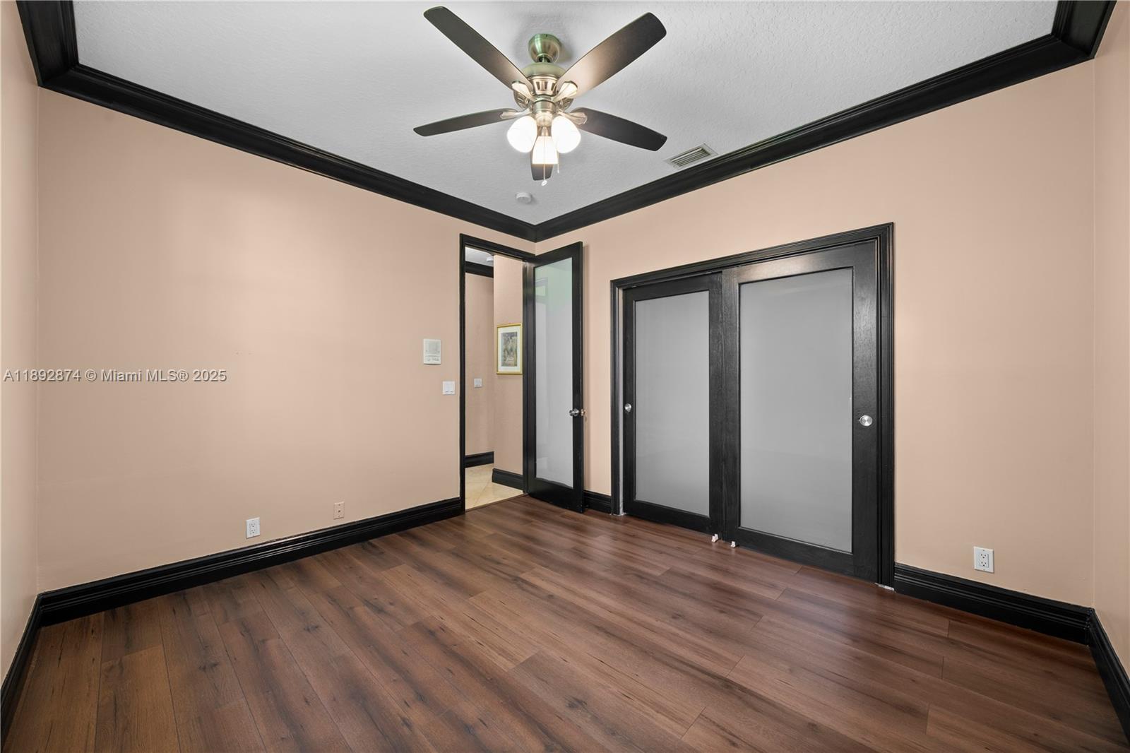 14130 Southwest 33rd Court Davie, FL 33330 - Photo 13 of 36 a view of an empty room with wooden floor