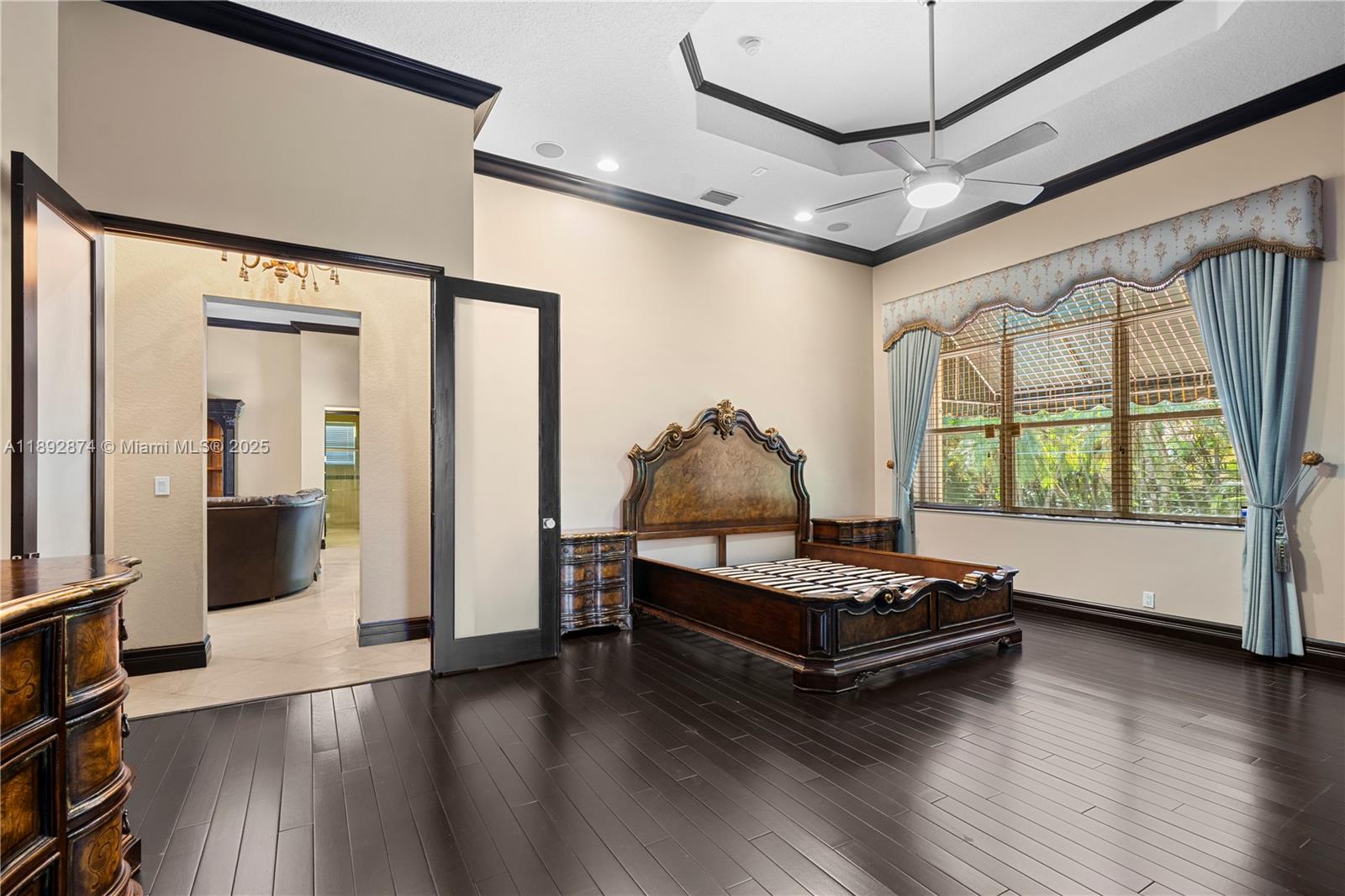 14130 Southwest 33rd Court Davie, FL 33330 - Photo 14 of 36 a living room with hard wood floors and a bed