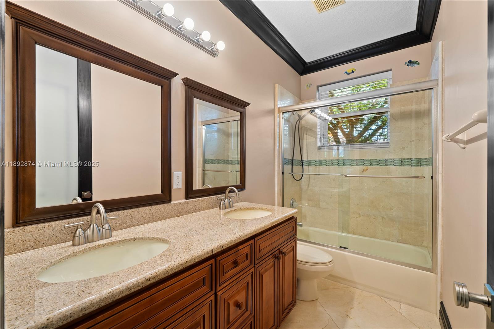 14130 Southwest 33rd Court Davie, FL 33330 - Photo 22 of 36 a bathroom with a granite countertop sink toilet and shower