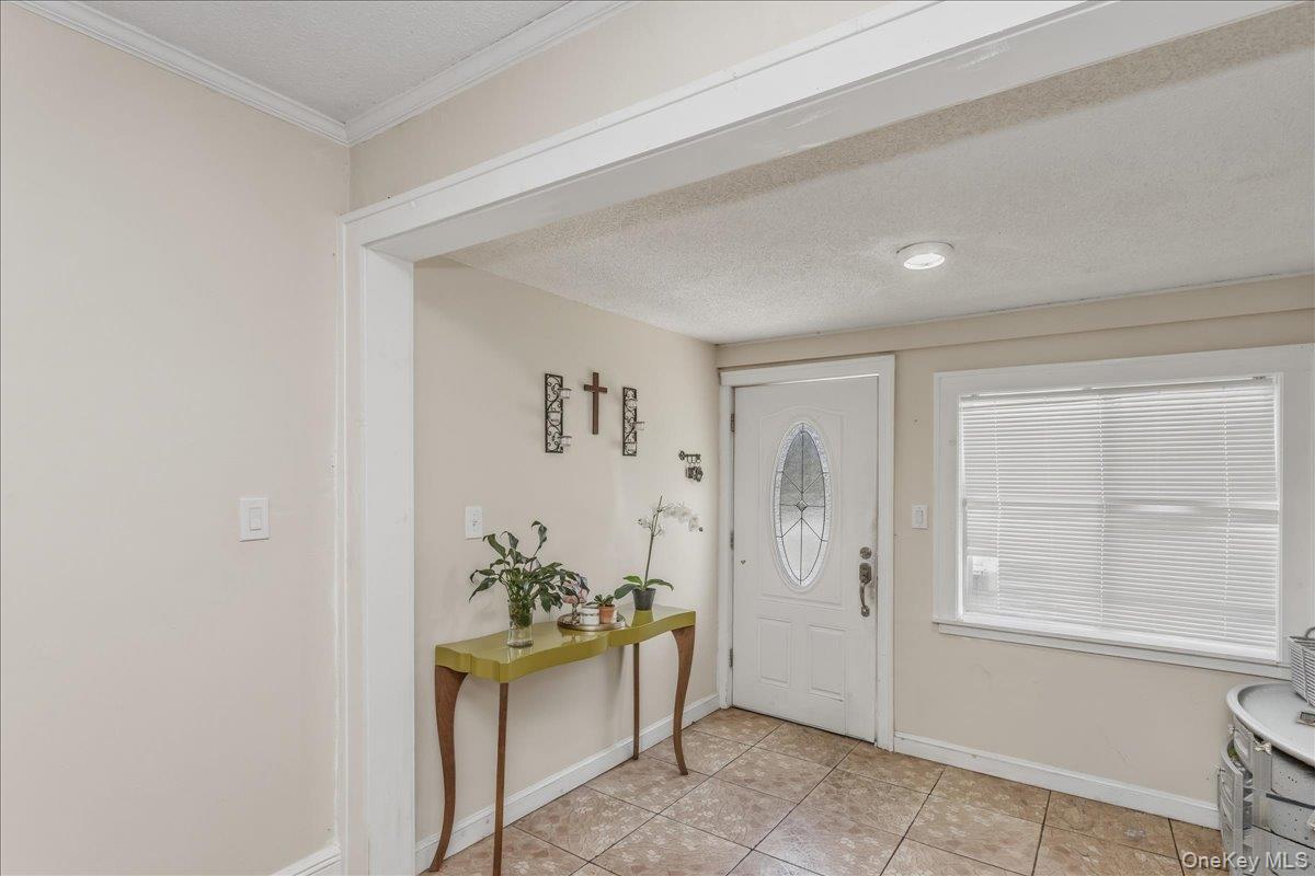 237 Rhodes Avenue Hempstead, NY 11550 - Photo 5 of 24 a view of an entryway with wooden floor