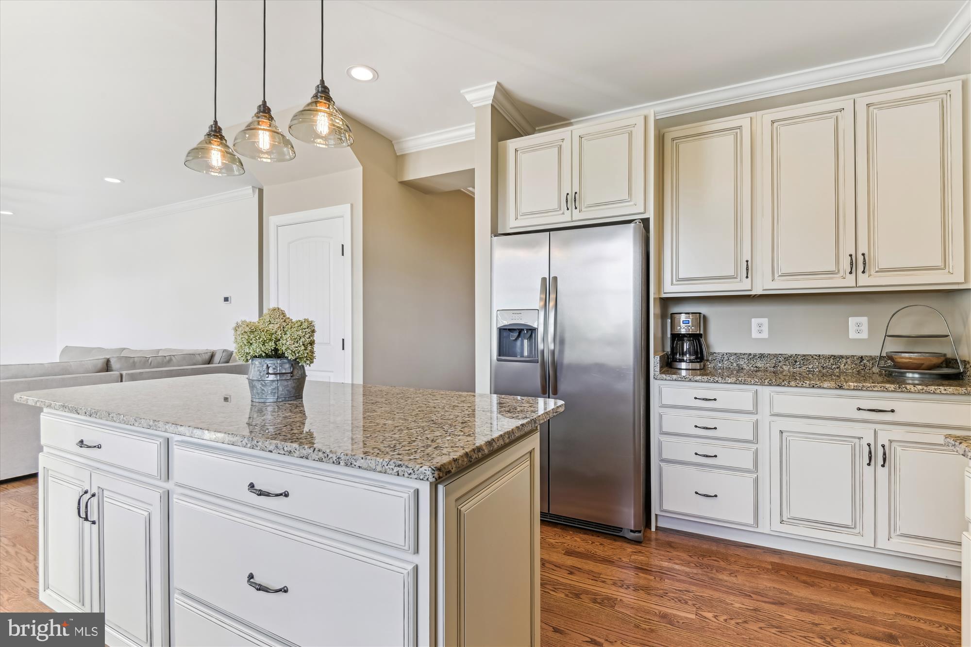 12700 Handboard Road Union Bridge, MD 21791 - Photo 16 of 74 a kitchen with stainless steel appliances granite countertop a refrigerator a sink dishwasher and white cabinets with wooden floor