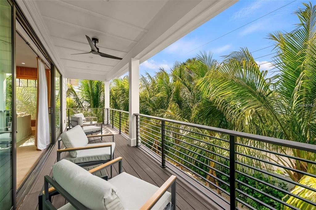 112 Maple Avenue Anna Maria, FL 34216 - Photo 21 of 91 a view of a chairs and table in patio with wooden floor