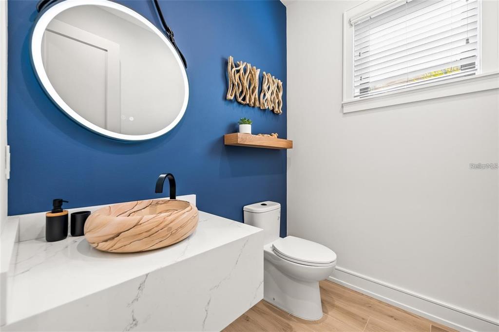 112 Maple Avenue Anna Maria, FL 34216 - Photo 23 of 91 a bathroom with a toilet sink and mirror