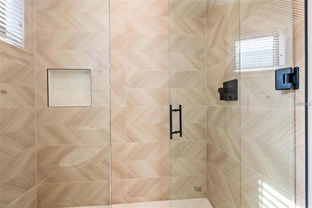 112 Maple Avenue Anna Maria, FL 34216 - Photo 27 of 91 a bathroom with a shower