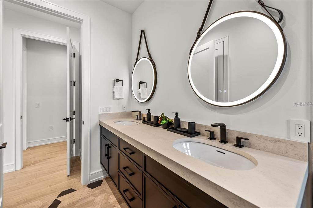 112 Maple Avenue Anna Maria, FL 34216 - Photo 33 of 91 a bathroom with a sink and a mirror