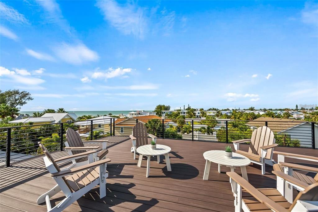 112 Maple Avenue Anna Maria, FL 34216 - Photo 47 of 91 a view of a chairs and table on the terrace