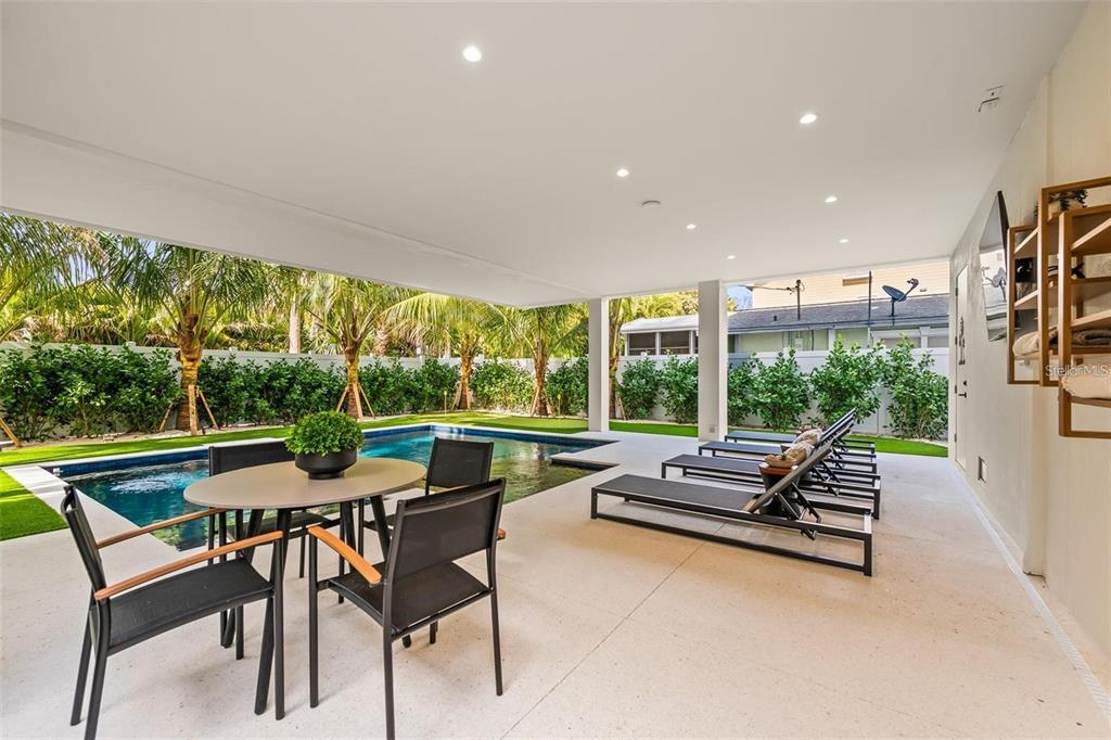 112 Maple Avenue Anna Maria, FL 34216 - Photo 69 of 91 a outdoor space with furniture and garden view