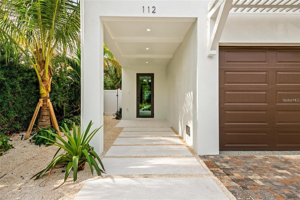 112 Maple Avenue Anna Maria, FL 34216 - Photo 7 of 91 a view of a entryway door front of house