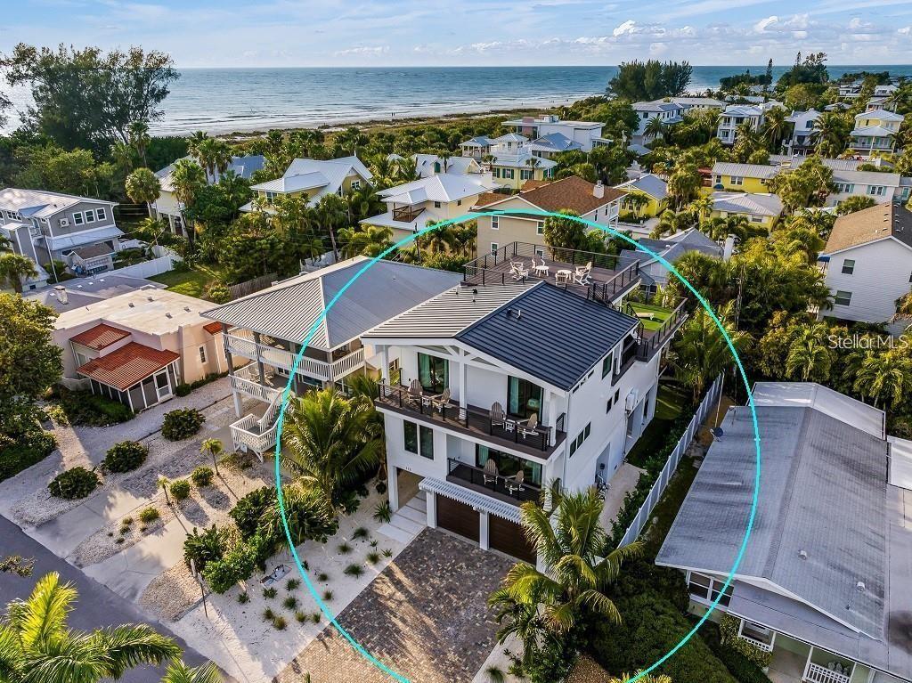 112 Maple Avenue Anna Maria, FL 34216 - Photo 80 of 91 an aerial view of a house with a garden