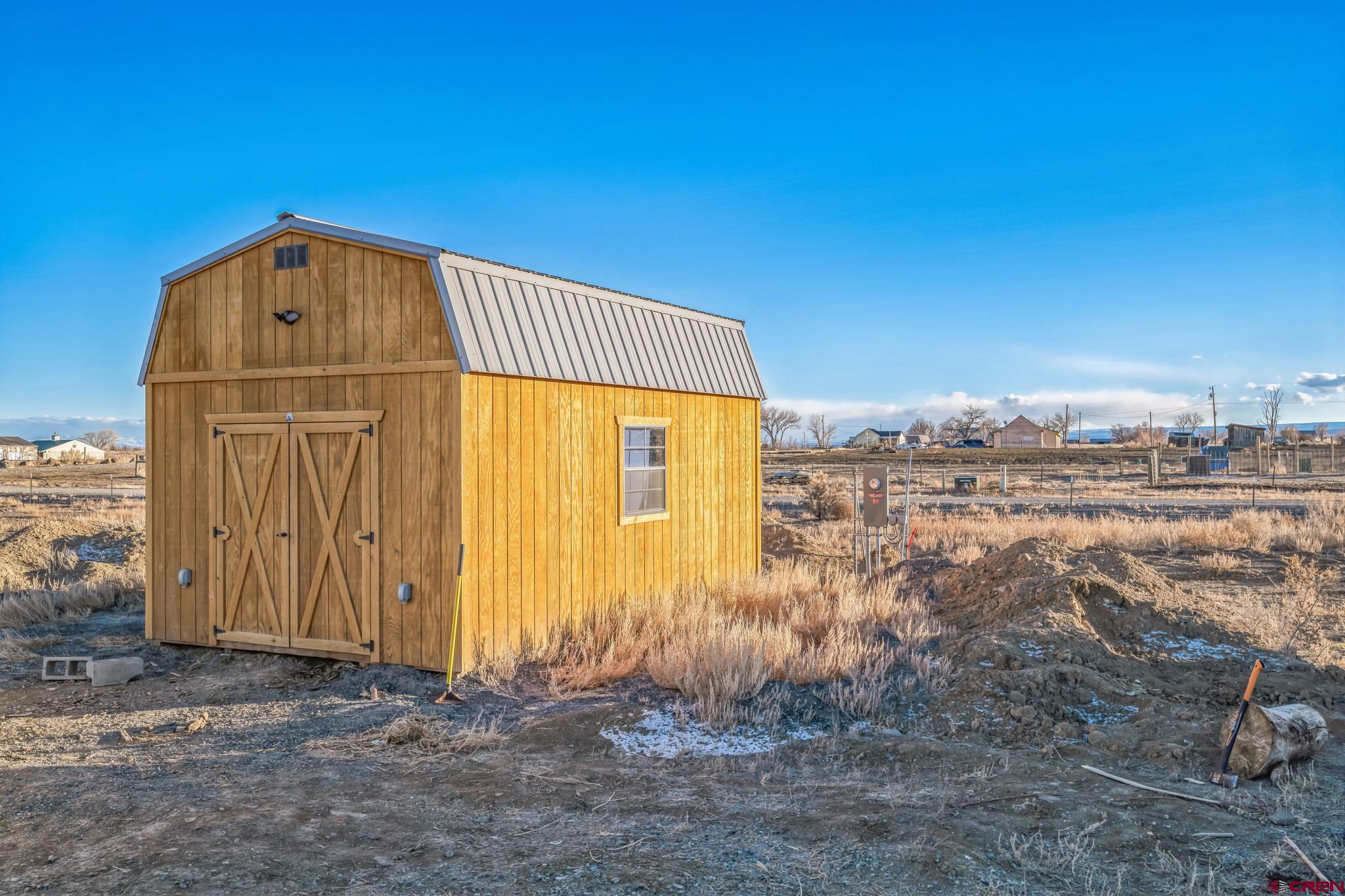 2279 1300th Road Delta, CO 81416 - Photo 4 of 8 a front view of a house with a yard
