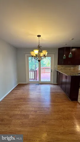 a kitchen with stainless steel appliances granite countertop wooden cabinets a stove top oven a sink and dishwasher