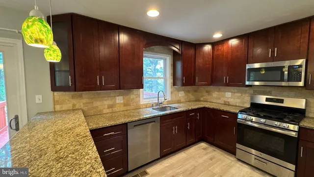 a view of kitchen with wooden floor