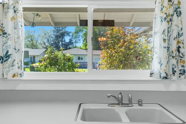a bathroom with a sink and a large window