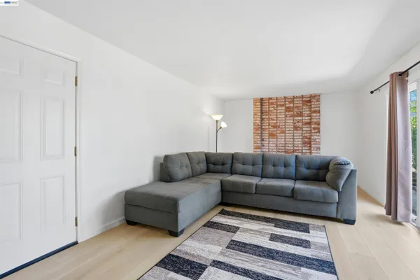 a living room with furniture and a rug