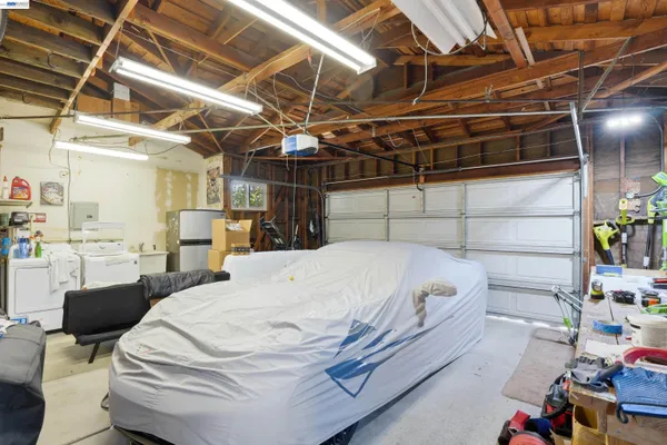 a bed sitting in a room next to a window