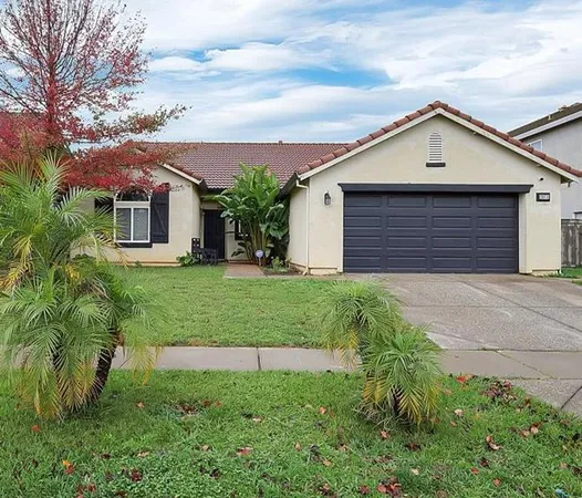 a view of front of house with a yard
