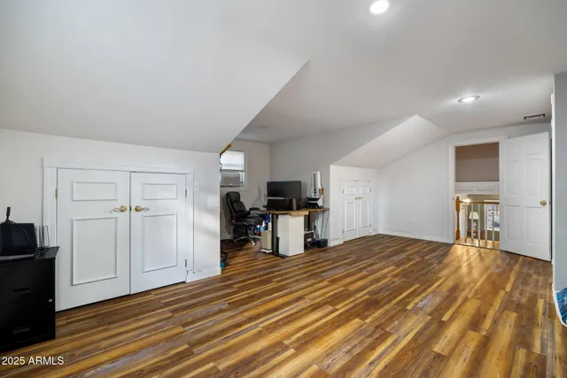 a bathroom with a sink a toilet a mirror and shower