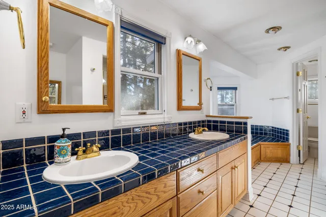 a bath tub sitting in a bathroom next to a window