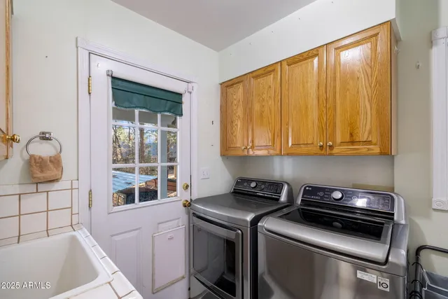 a view of a yard with large trees