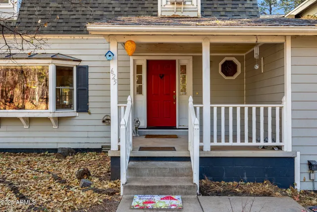 a view of front door of house with stairs