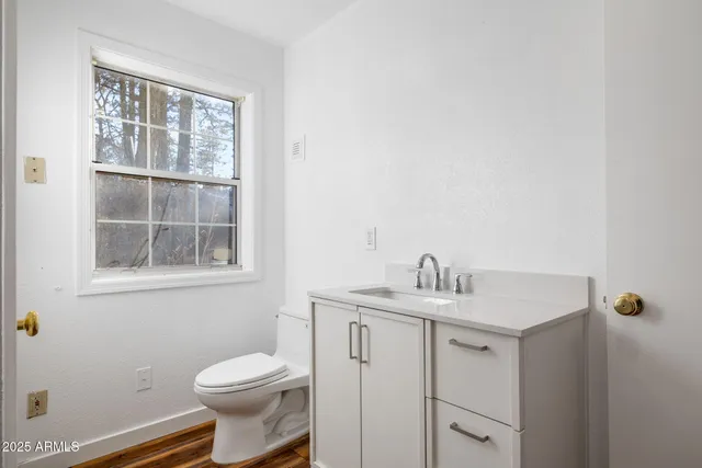 a living room with furniture fireplace and a window