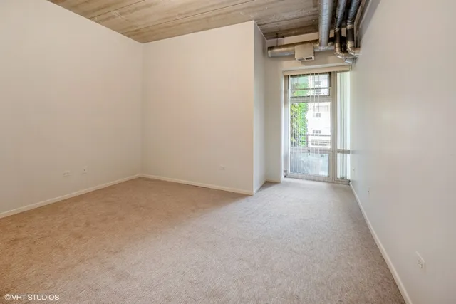 a view of empty room with floor to ceiling window