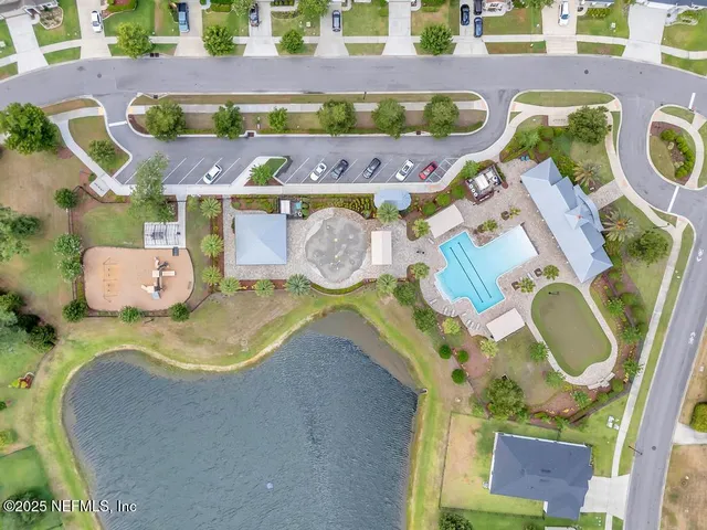 an aerial view of a house with outdoor space