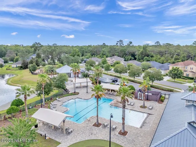 an aerial view of a house with garden space and patio
