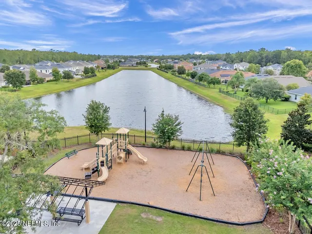 a view of swimming pool with outdoor seating