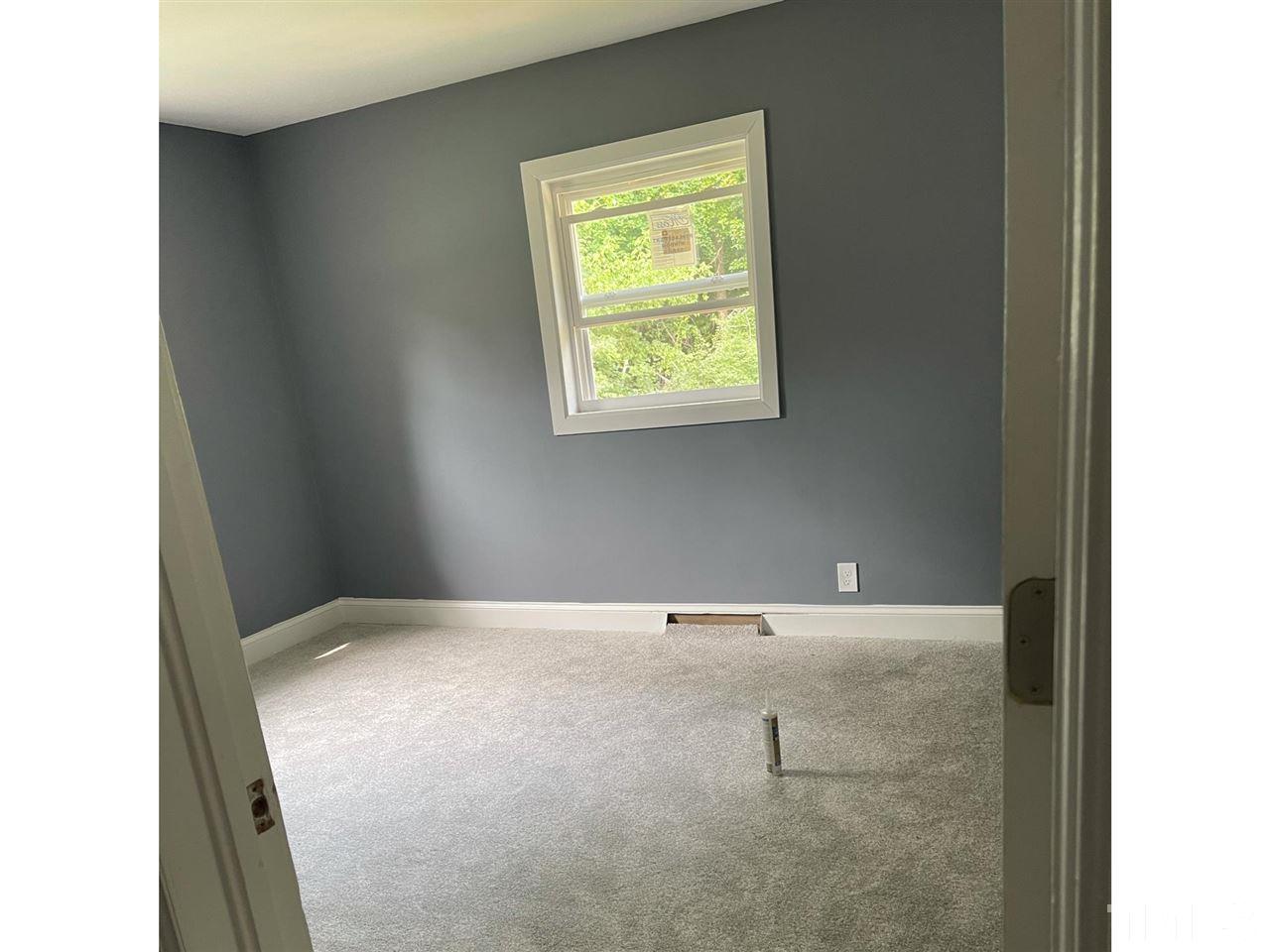 50 Henderson Road Roxboro, NC 27573 - Photo 4 of 6 a view of an empty room with a window