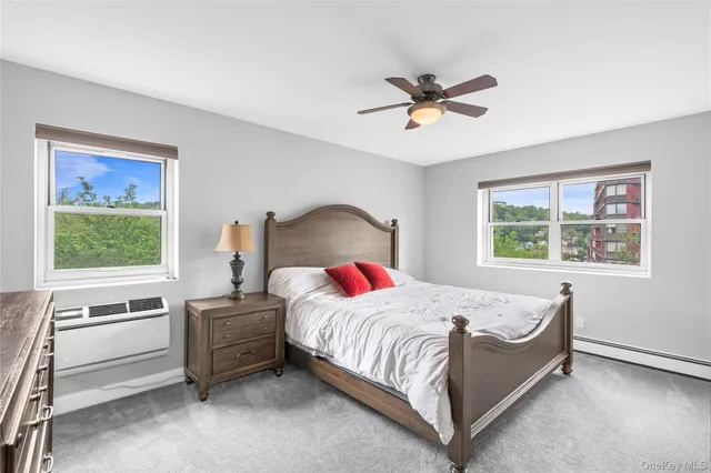 a bedroom with a bed and a table in it