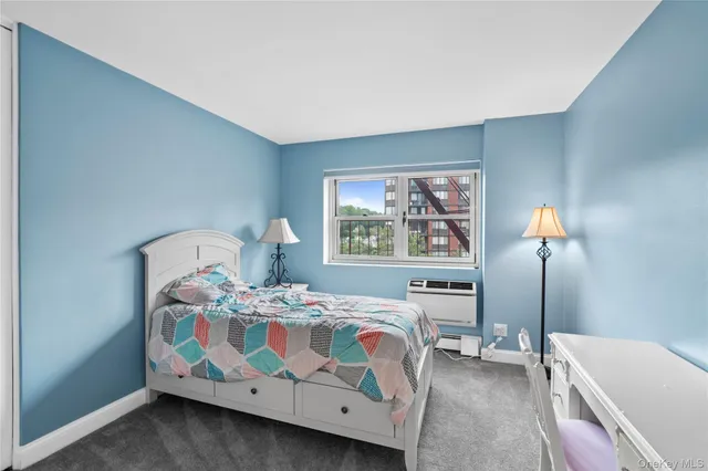 a bathroom with double sink and a mirror