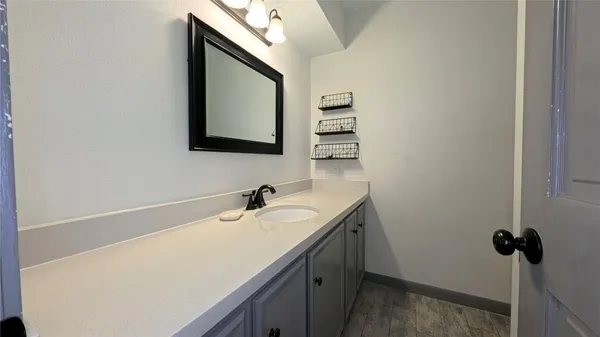 a bathroom with a sink and a mirror