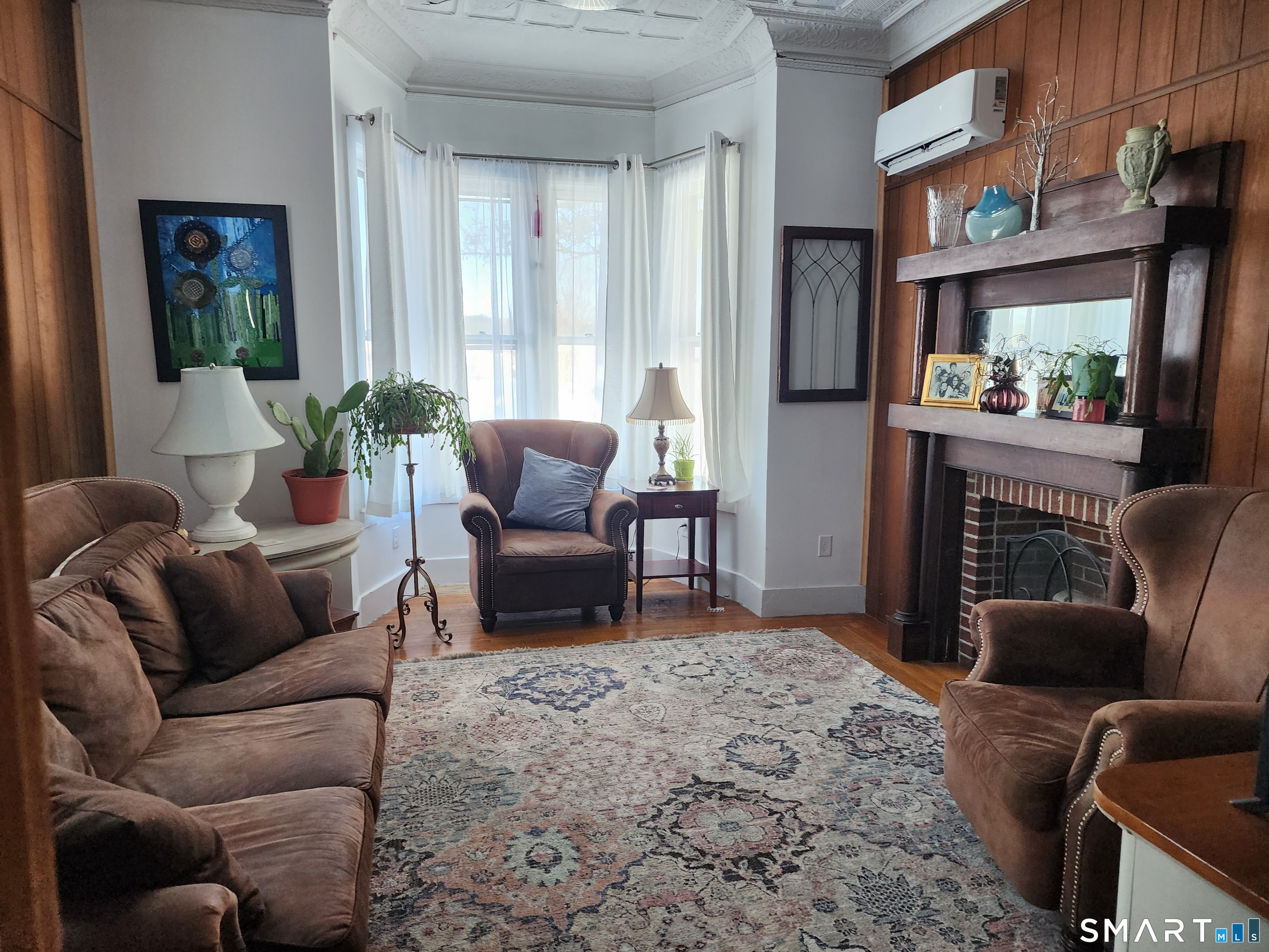 350 Hartford Pike Killingly, CT 06241 - Photo 5 of 28 a living room with furniture fireplace and a large window