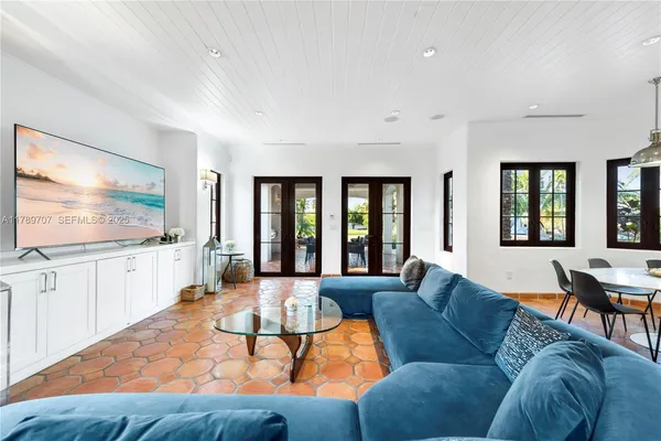 a large kitchen with stainless steel appliances granite countertop a stove and cabinets