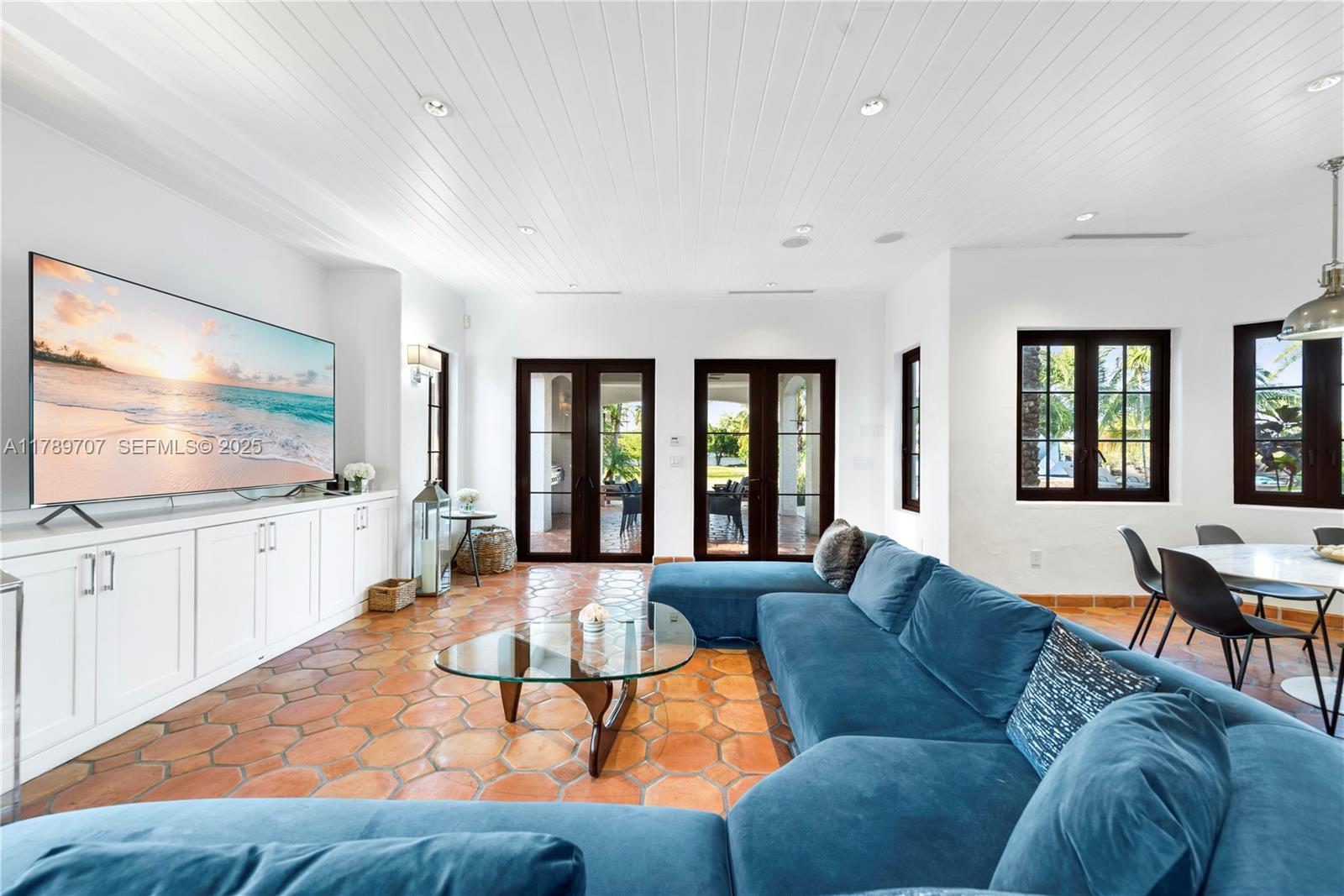 1201 Northeast 83rd Street Miami, FL 33138 - Photo 14 of 67 a living room with furniture and a flat screen tv