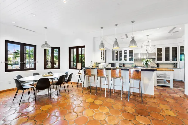 a kitchen with stainless steel appliances granite countertop a sink and a counter space