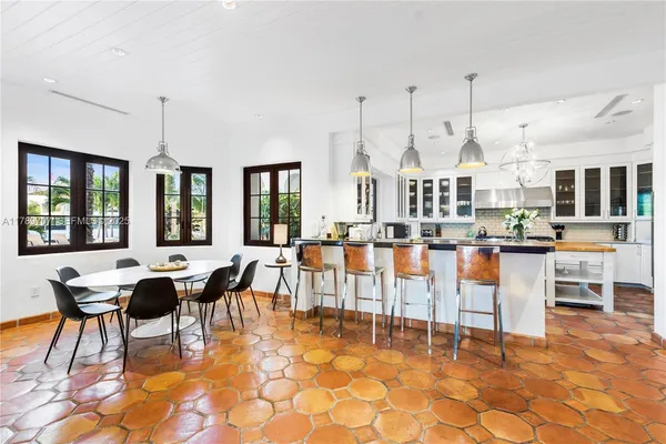 a large kitchen with stainless steel appliances granite countertop a sink and counter space
