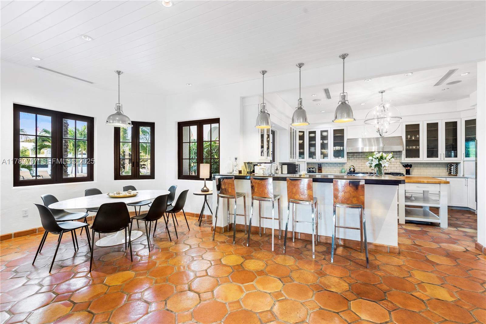 1201 Northeast 83rd Street Miami, FL 33138 - Photo 15 of 67 a living room filled with lots of furniture and a table