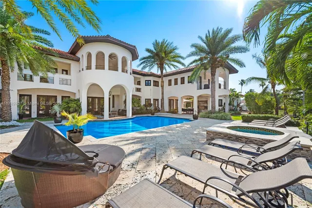 a view of house with swimming pool outdoor seating