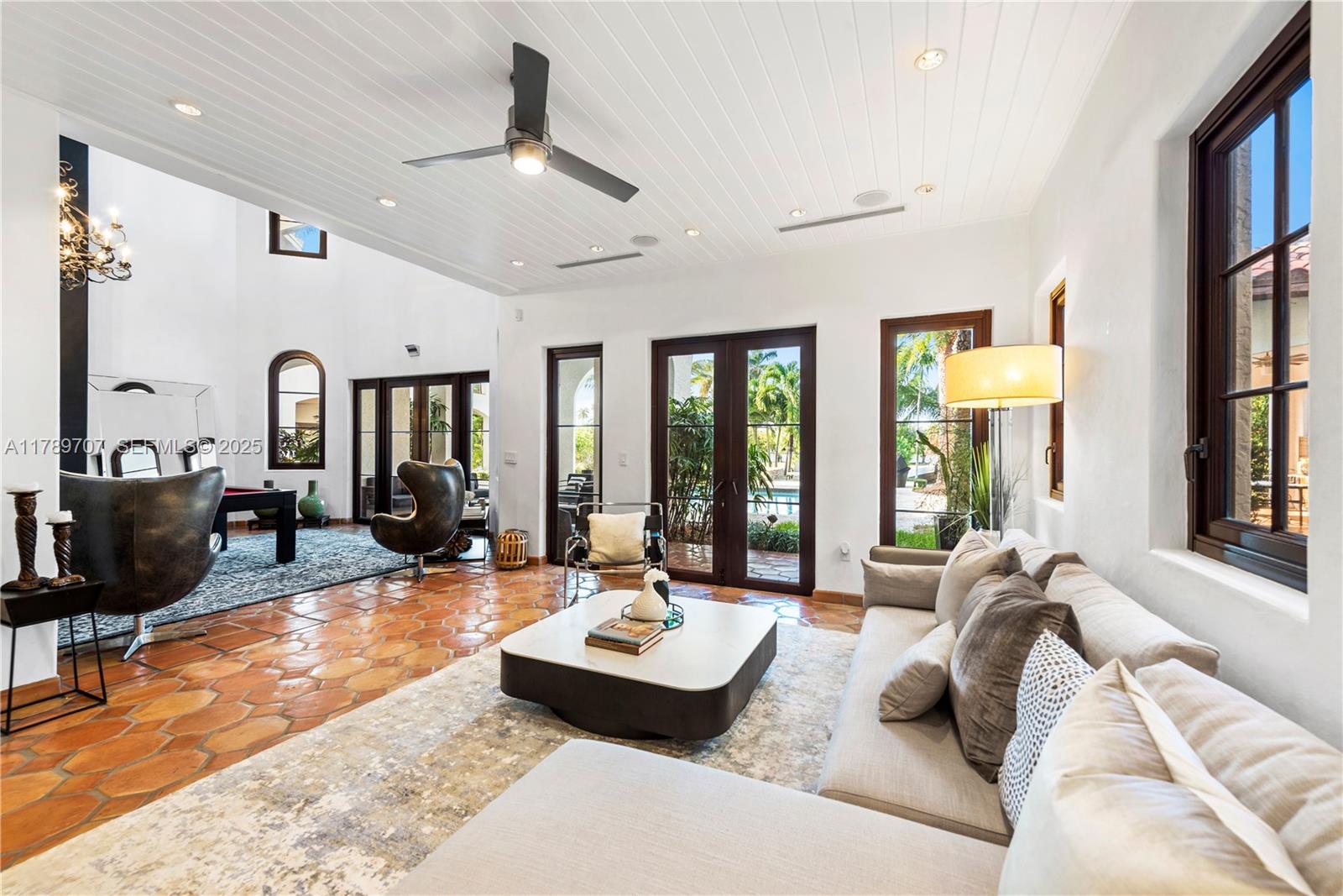 1201 Northeast 83rd Street Miami, FL 33138 - Photo 23 of 67 a living room with furniture large window and flat screen tv