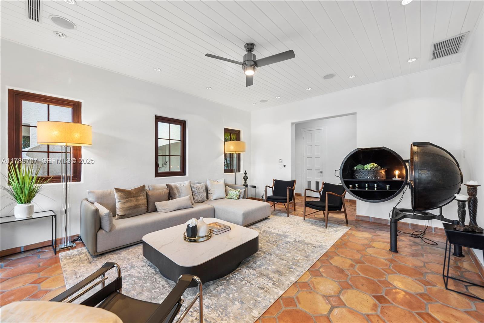 1201 Northeast 83rd Street Miami, FL 33138 - Photo 24 of 67 a living room with furniture a rug and a window