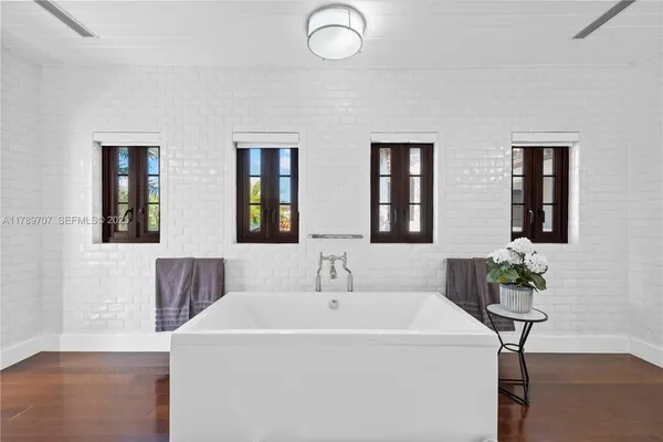 a bathroom with a sink toilet and mirror