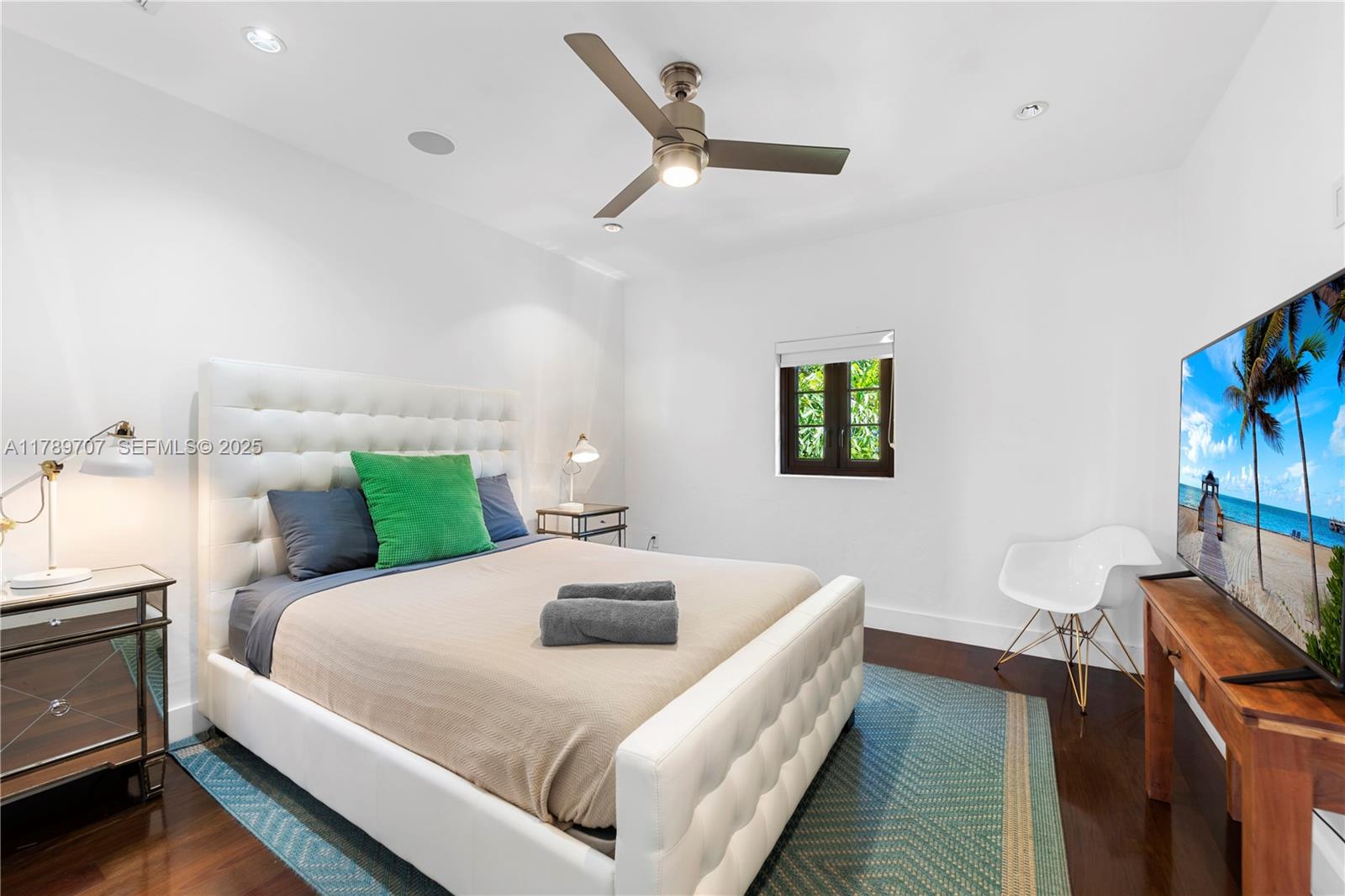 1201 Northeast 83rd Street Miami, FL 33138 - Photo 40 of 67 a bedroom with a bed and a tv