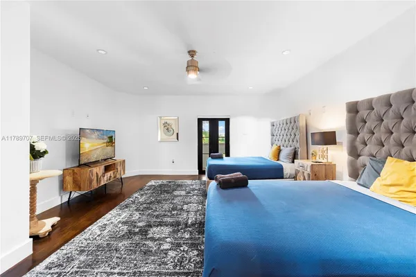 a couple of palm trees in front of house